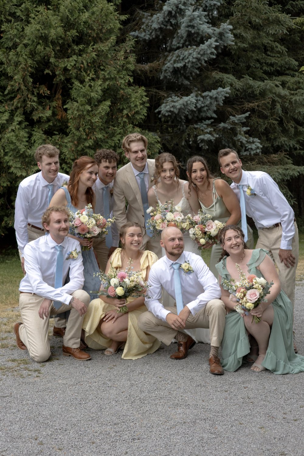 Wedding party portrait surrounded by trees at Kurtz Orchards
