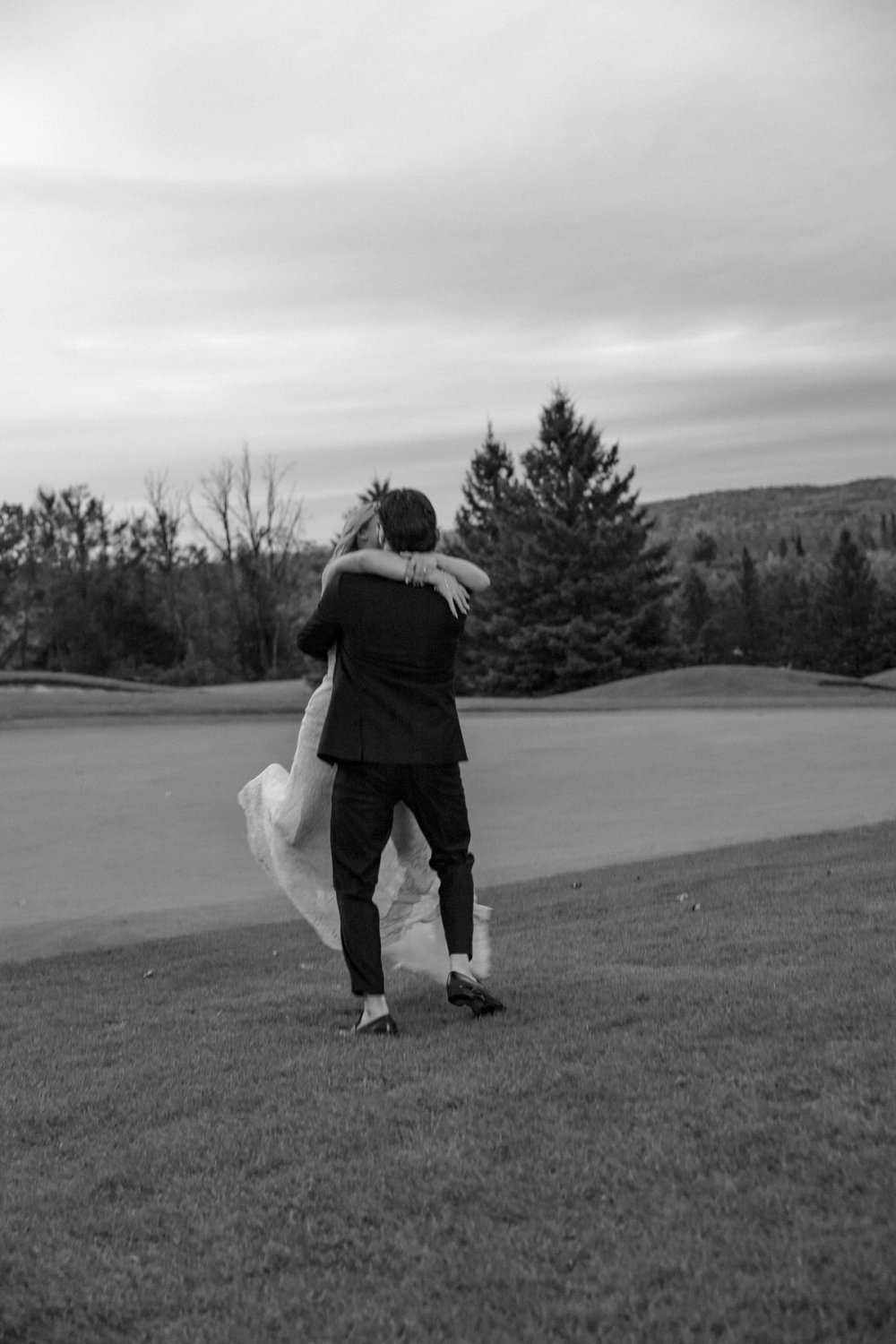 bride and groom spinning in sunset photos Barrie Country Club Wedding