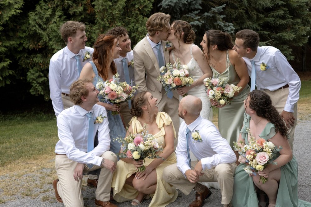 Bridal party laughing together during Niagara-on-the-Lake wedding portraits