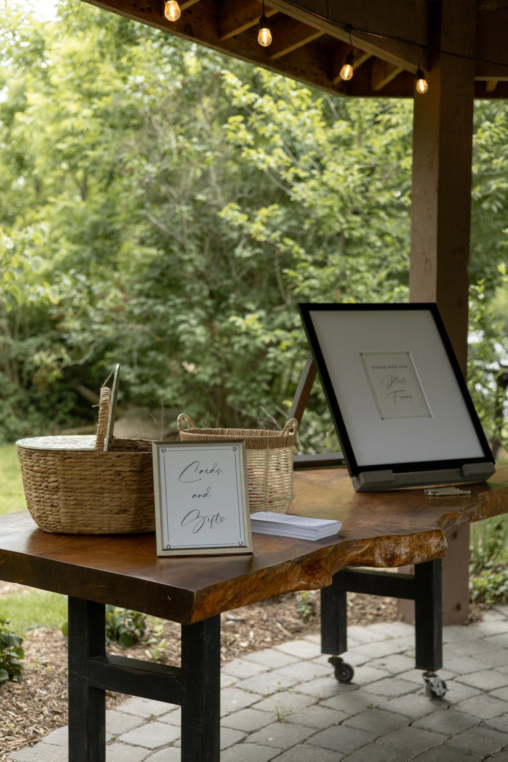 Welcome table under gazebo at Niagara, Ontario wedding