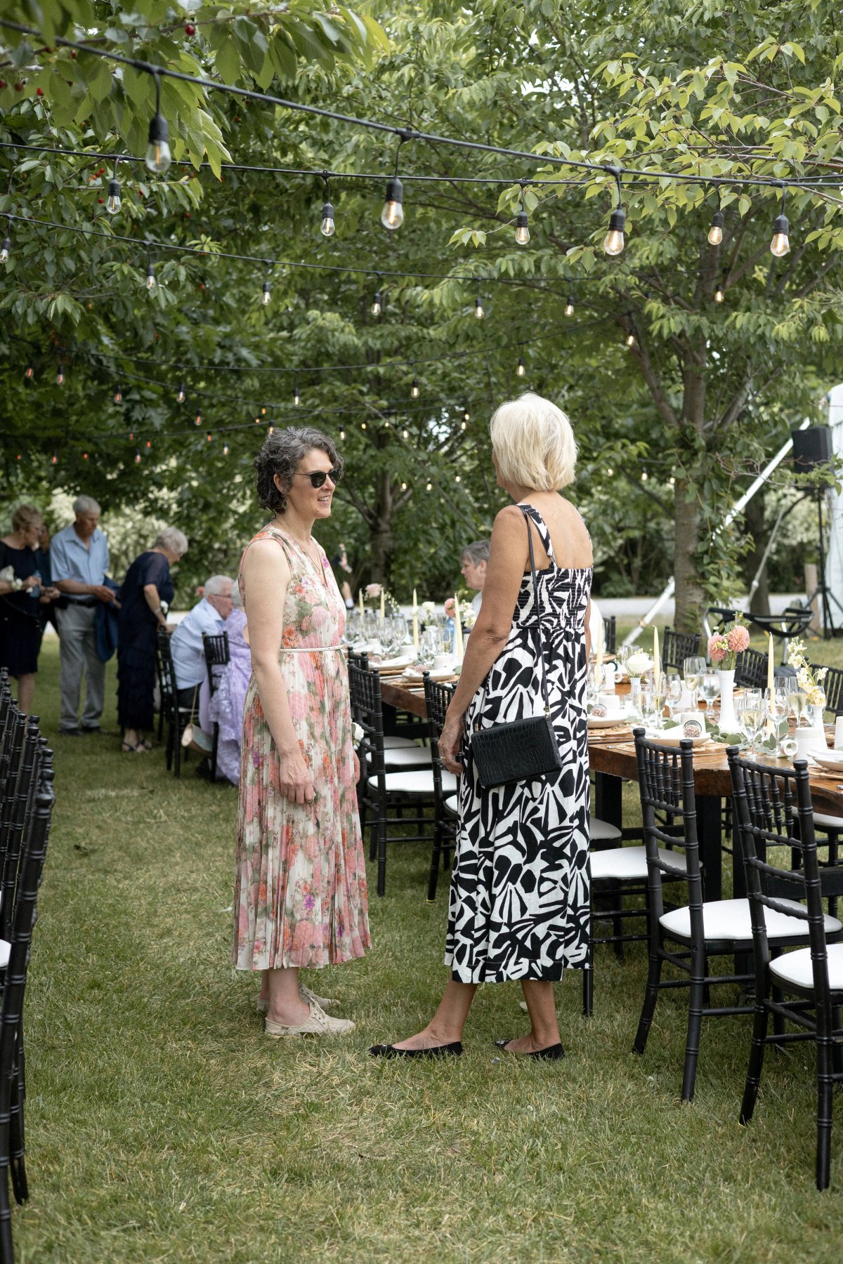Guests mingling during outdoor wedding reception Kurtz Orchard