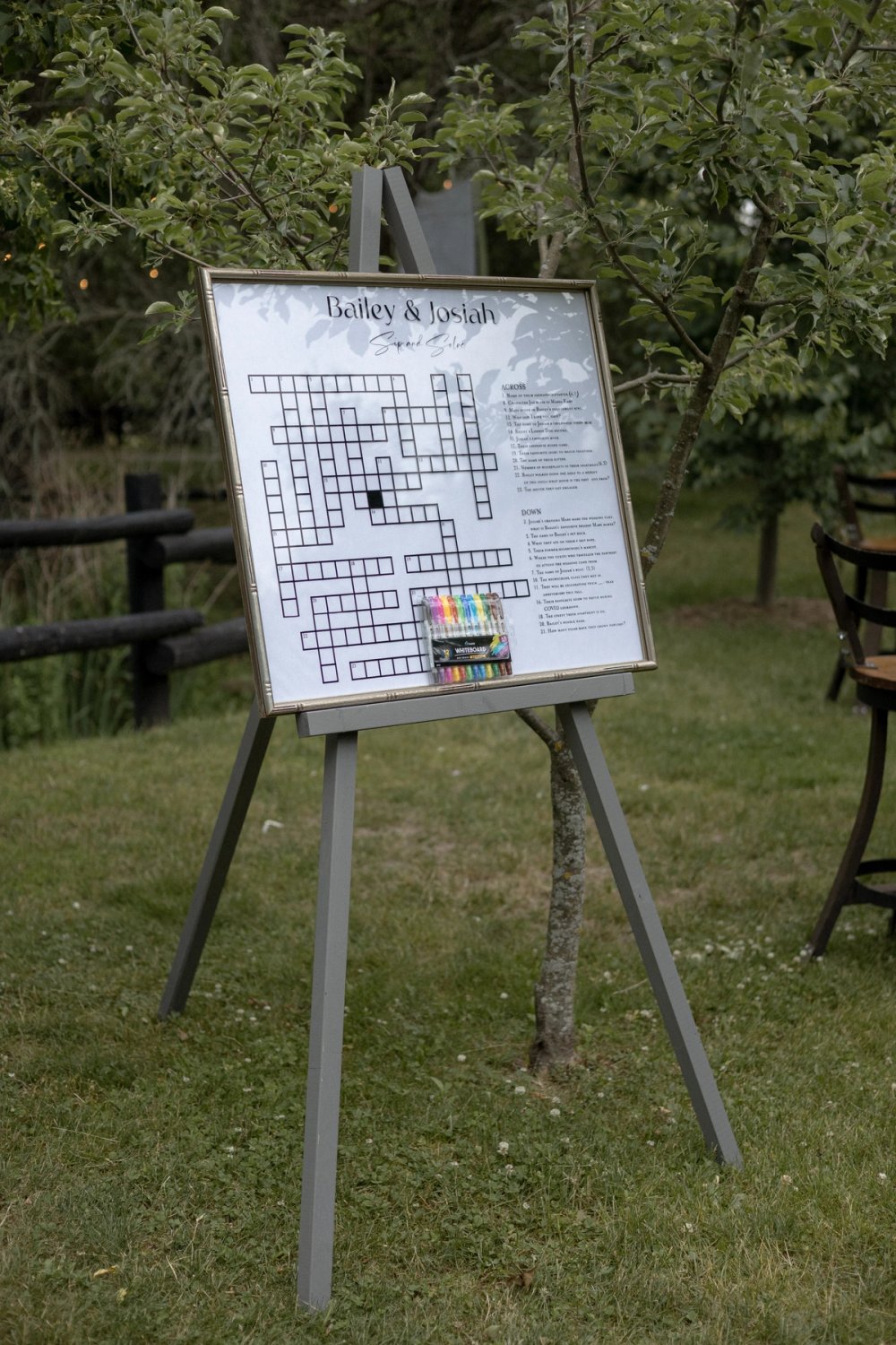 Crossword cocktail reception game at outdoor wedding in Niagara orchards