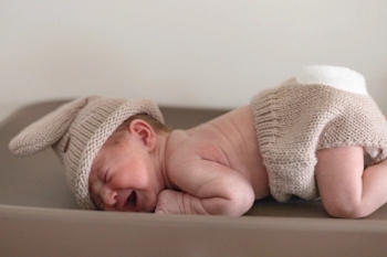 newborn baby with knitted bunny hat and diaper - Newborn Photography