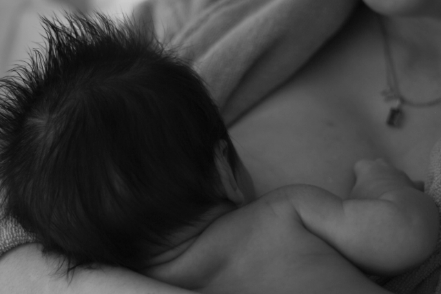 black and white close up of baby breastfeeding - Newborn photography