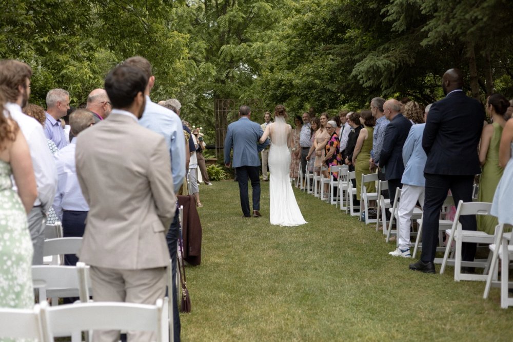 Bride walking down aisle with father at Kurtz Orchards wedding