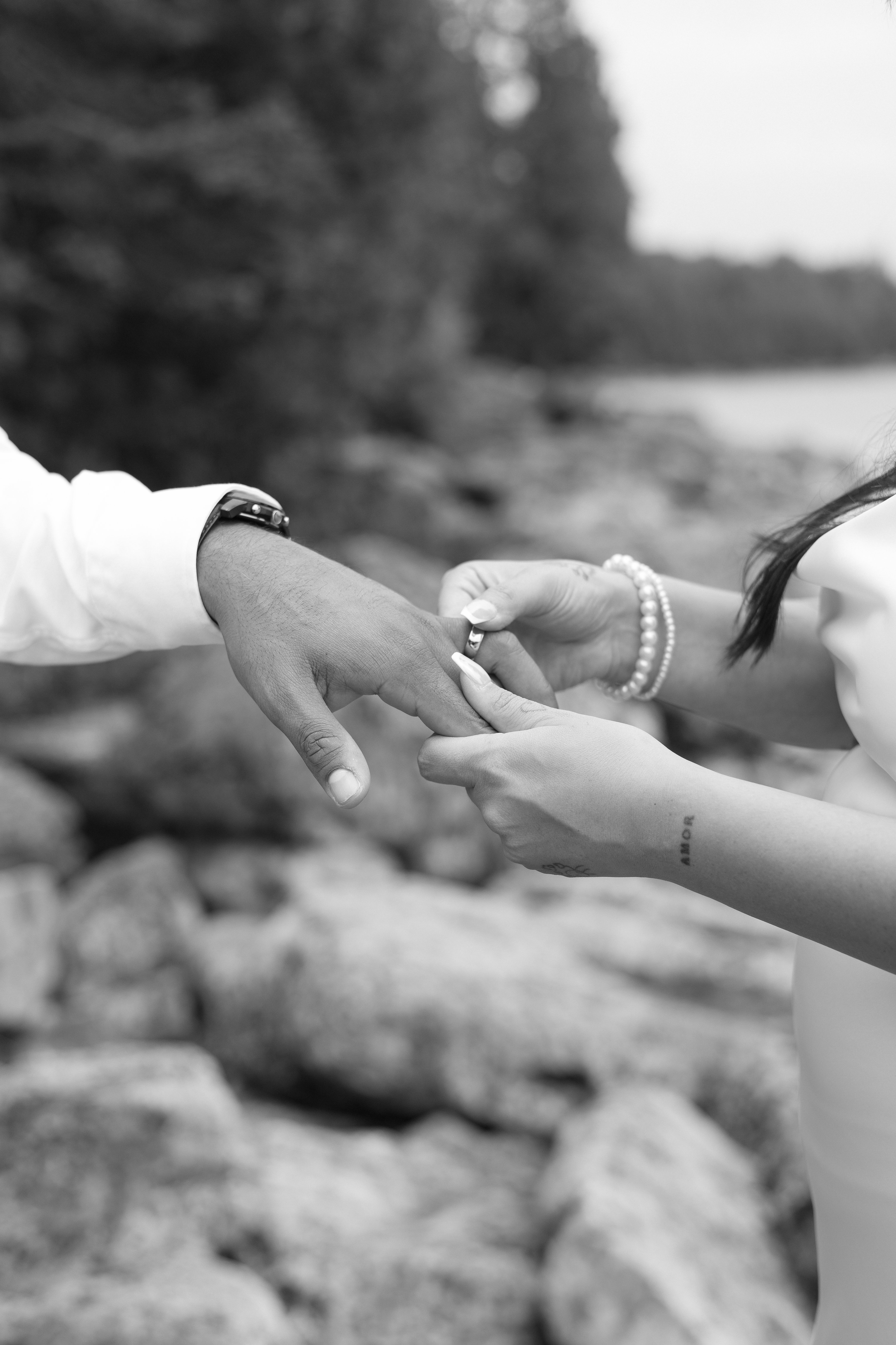 bride putting ring on groom  - Tobermory Elopement photography