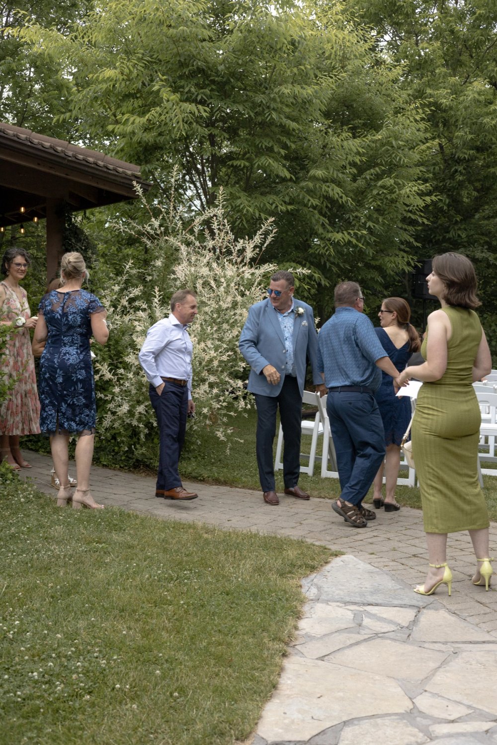 Candid moment of guests arriving for wedding ceremony