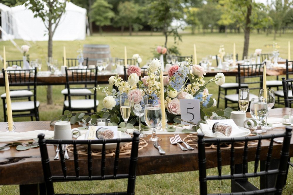 Head table florals at outdoor summer garden party wedding