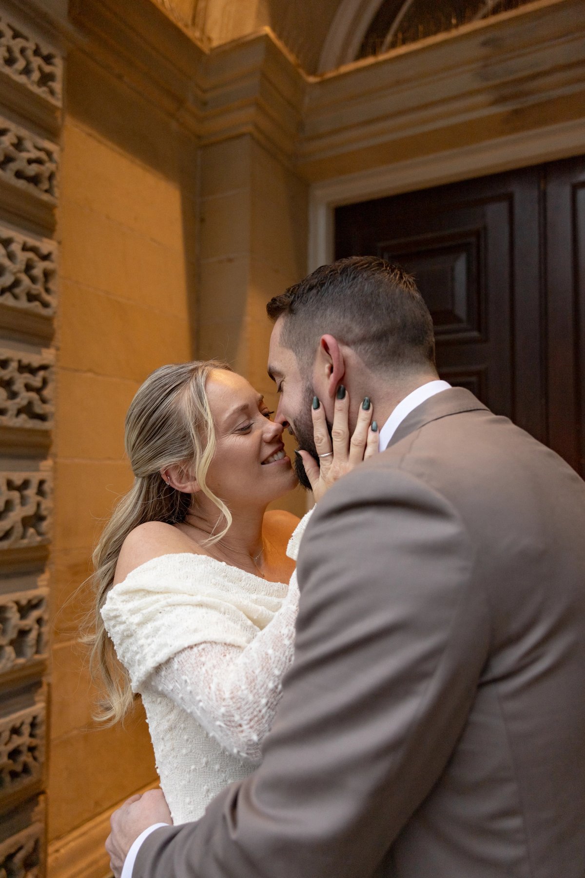 Documentary wedding photographer capturing couple smiling sweetly at each other