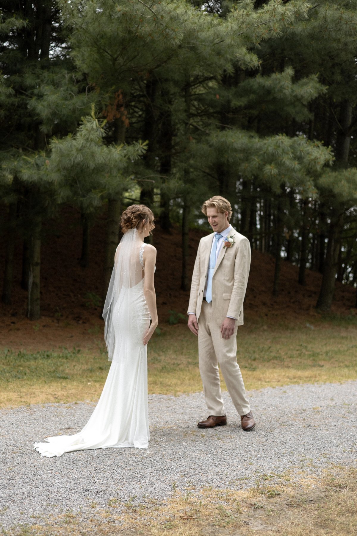 First look on a gravel path at Kurtz Orchards wedding in Niagara-on-the-Lake