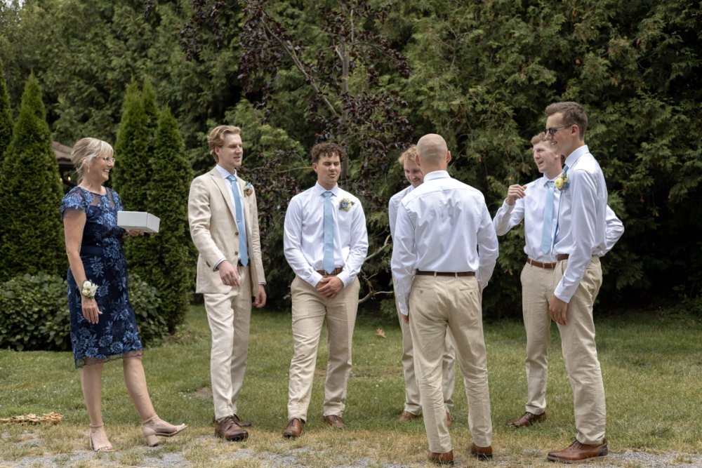Bridal party gathered along tree-lined path at Kurtz Orchards wedding