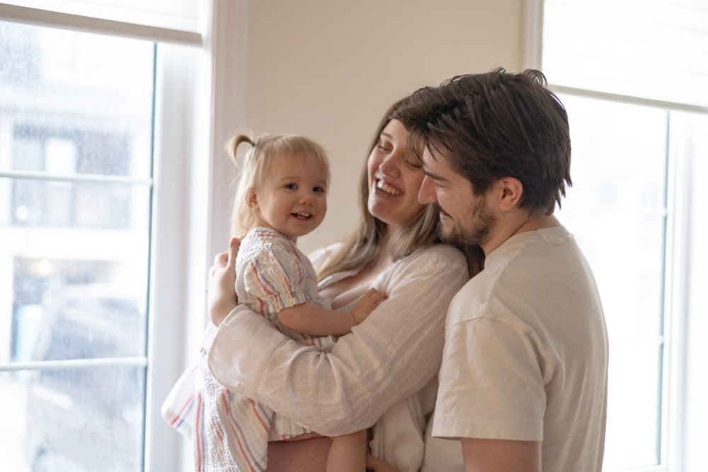 Close up image of family embracing - Newmarket Family Photographer