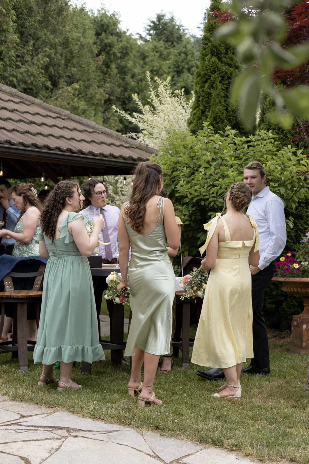 wedding party laughing with guests during cocktail reception