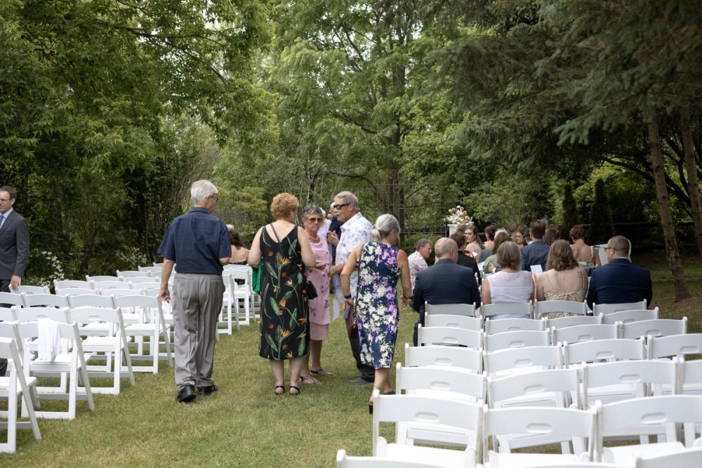 Wedding guests finding their seats before ceremony