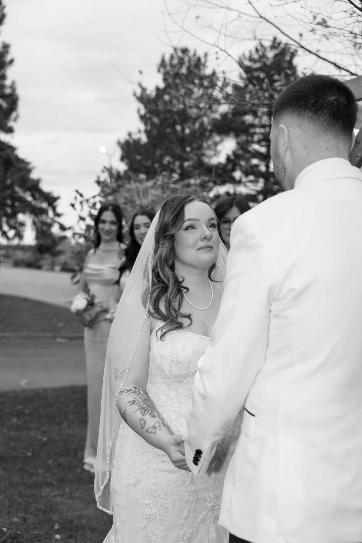 Couple reading vows at an outdoor wedding at Rockway Vineyards