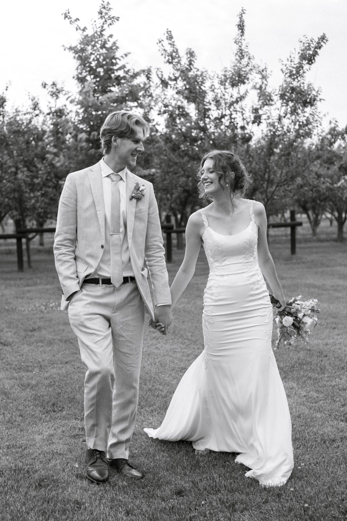Natural wedding moment during portraits at Kurtz Orchards Niagara-on-the-Lake