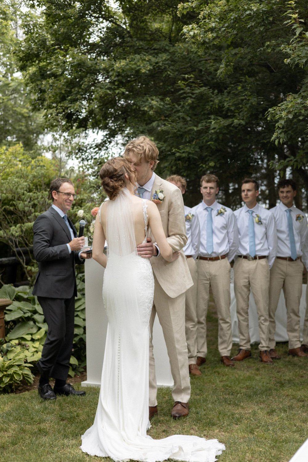 Couple kissing during wedding ceremony