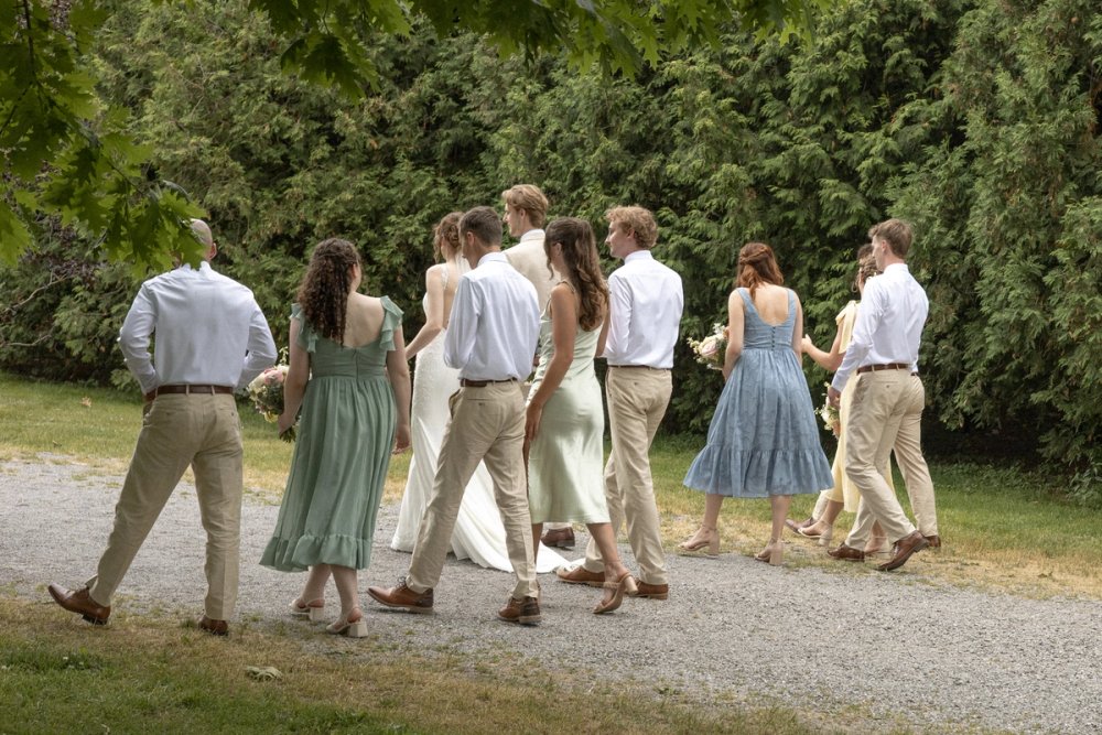 Bridal party walking together during wedding portraits
