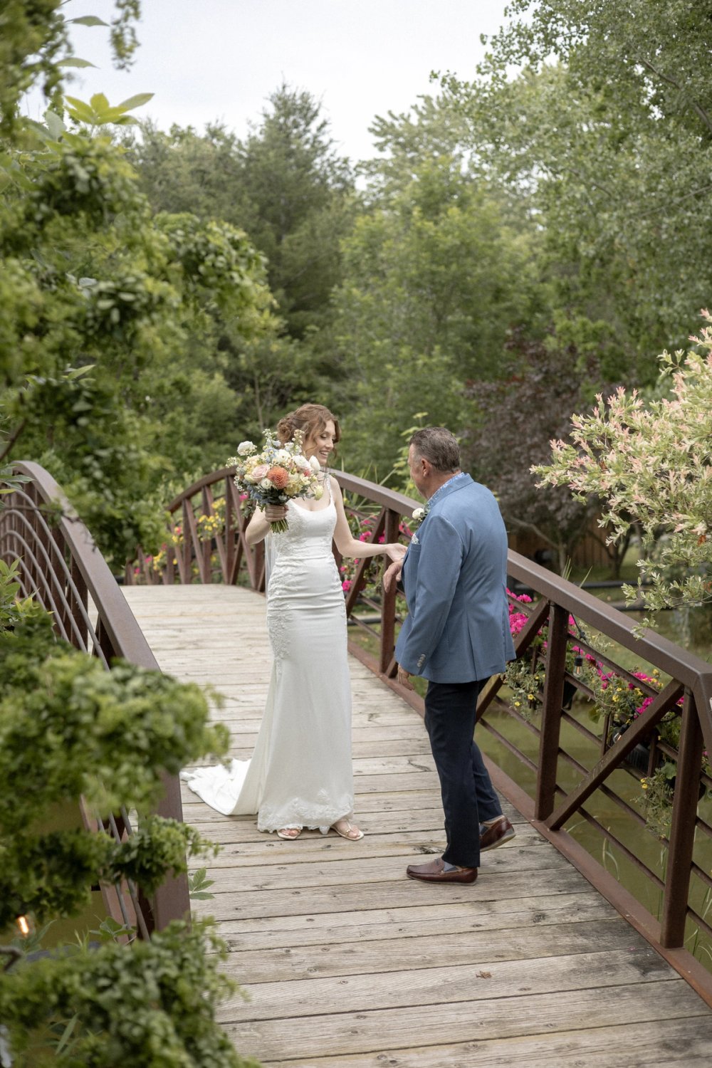Bride greeting father before wedding ceremony