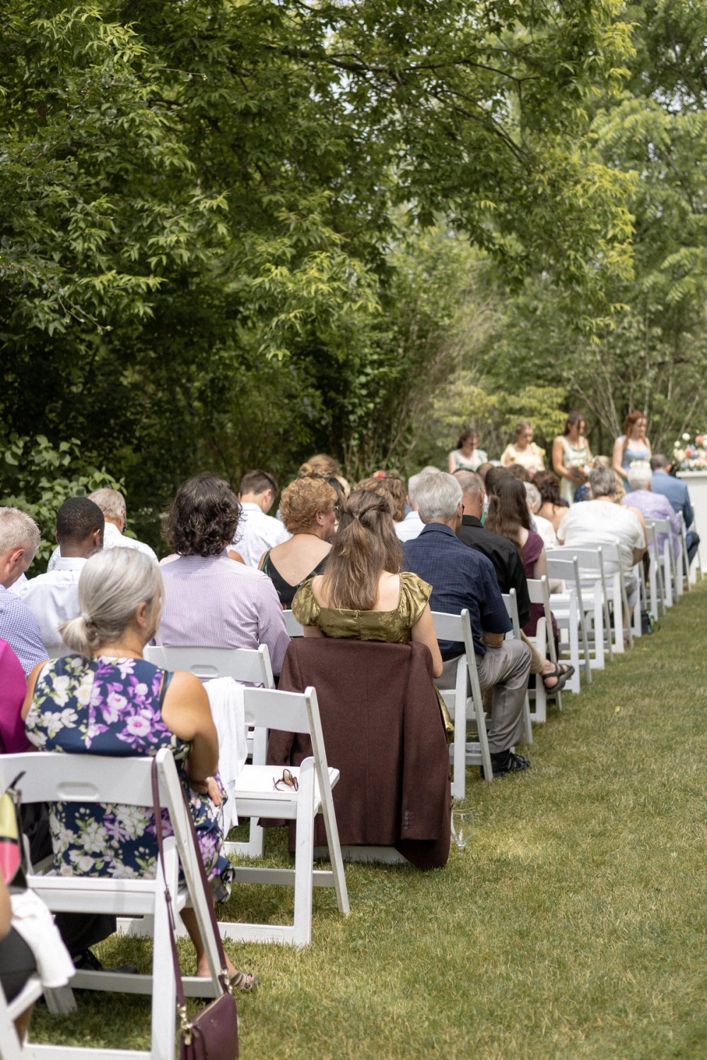 guests seated at colourful outdoor wedding ceremony