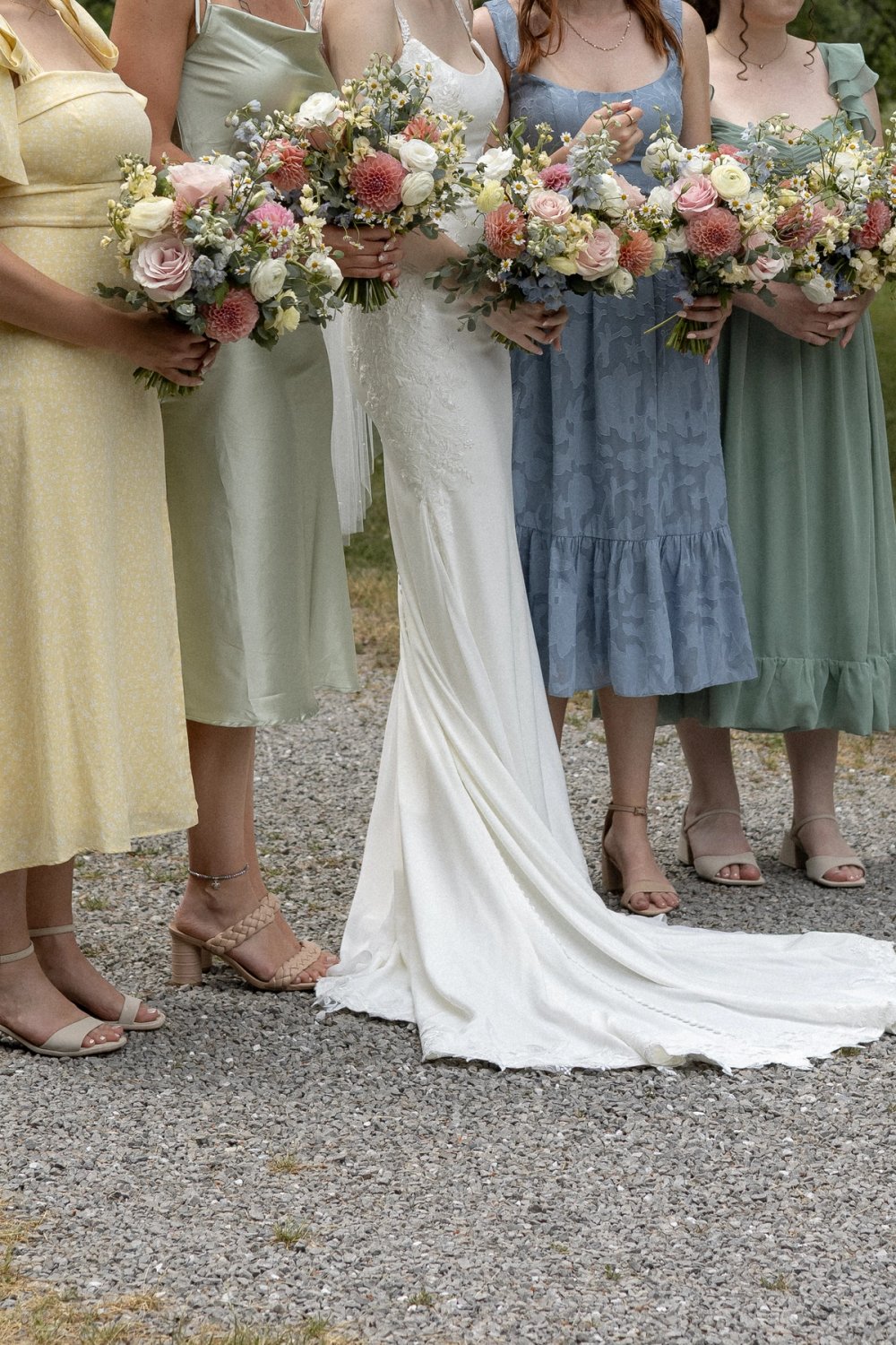 wedding party summer dresses and bouquets at Niagara wedding