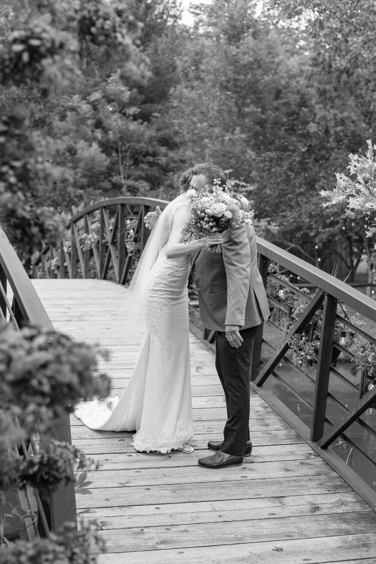 bride hugging dad on bridge before Kurtz Orchard Wedding Ceremony in Niagara-on-the-Lake