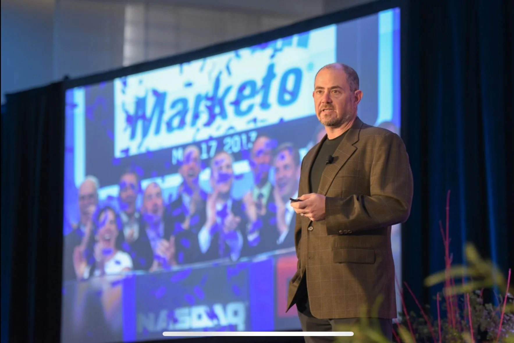 Jon Miller speaking on stage