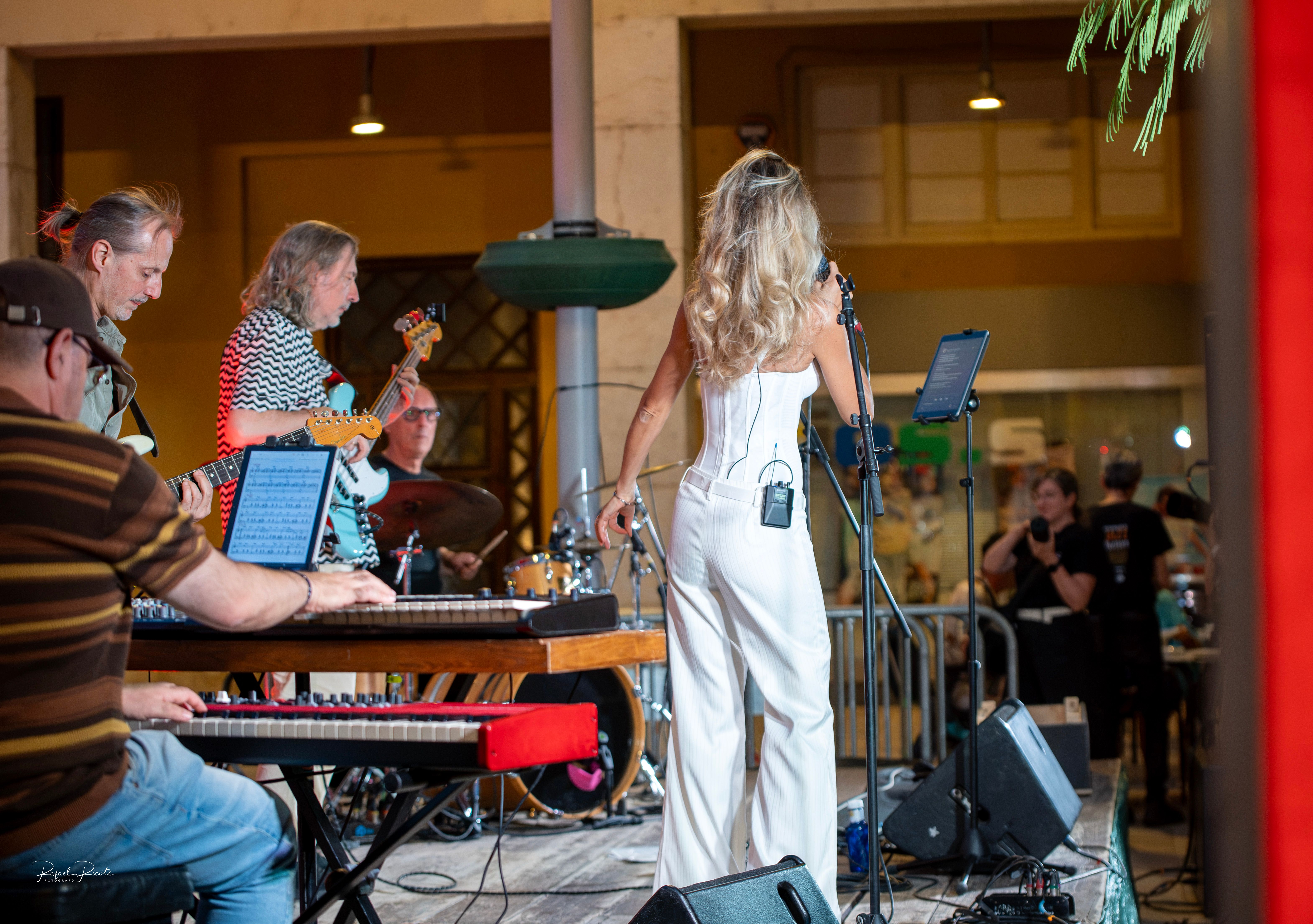 A singer performing with a band
