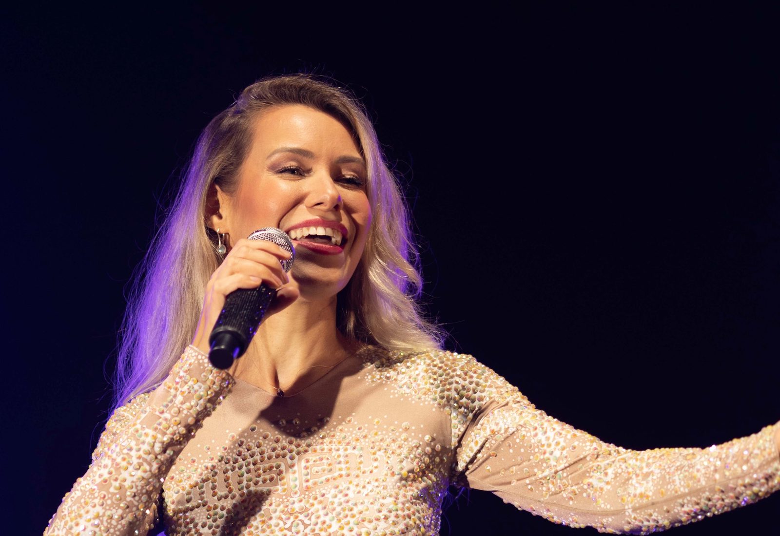 A singer performing solo on stage