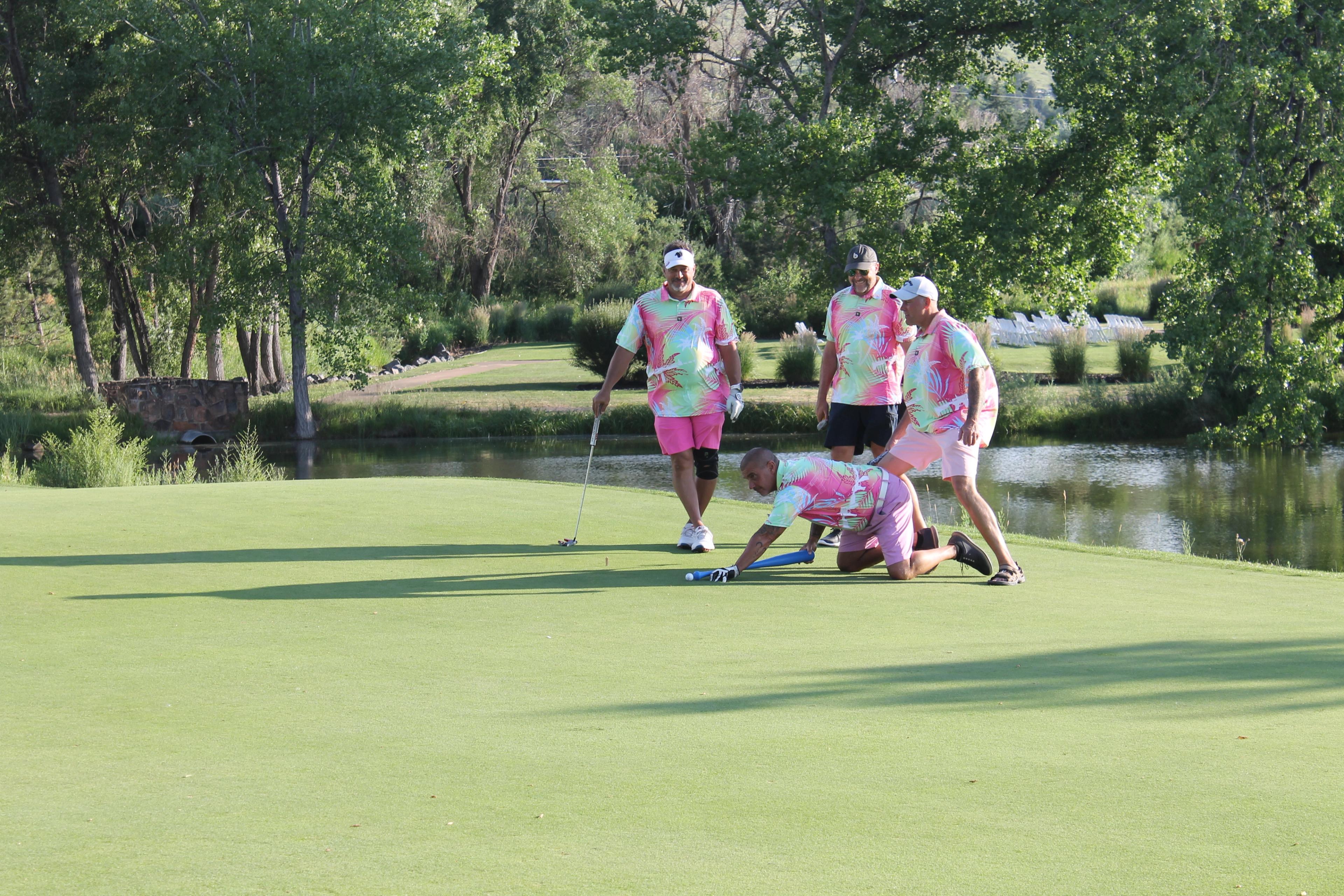 It's good to have your friends supporting you while putting with a pool noodle
