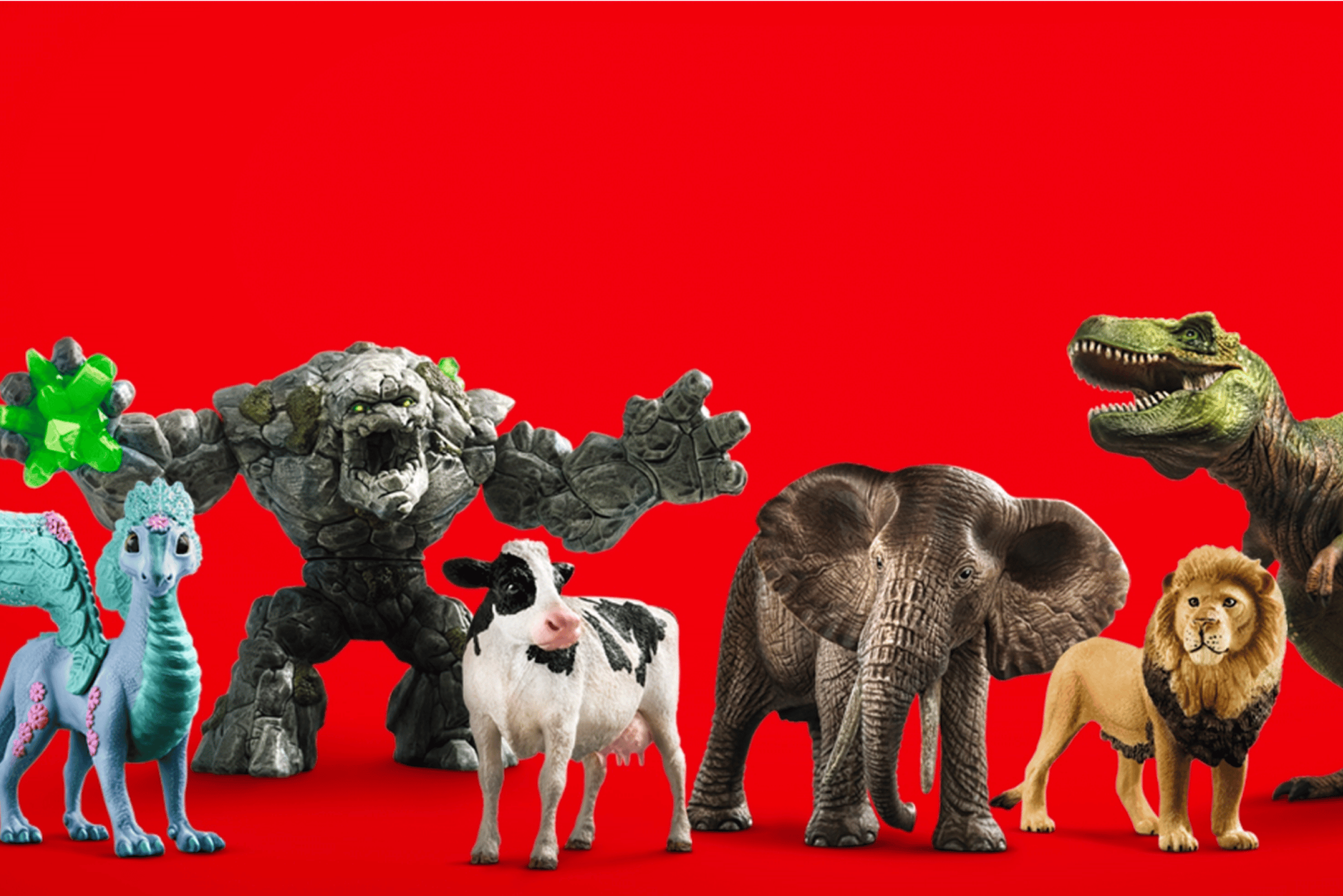 Various Schleich figurines on a red background