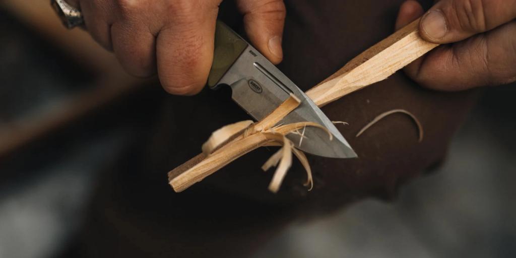 A Benchmade knife used to cut wood