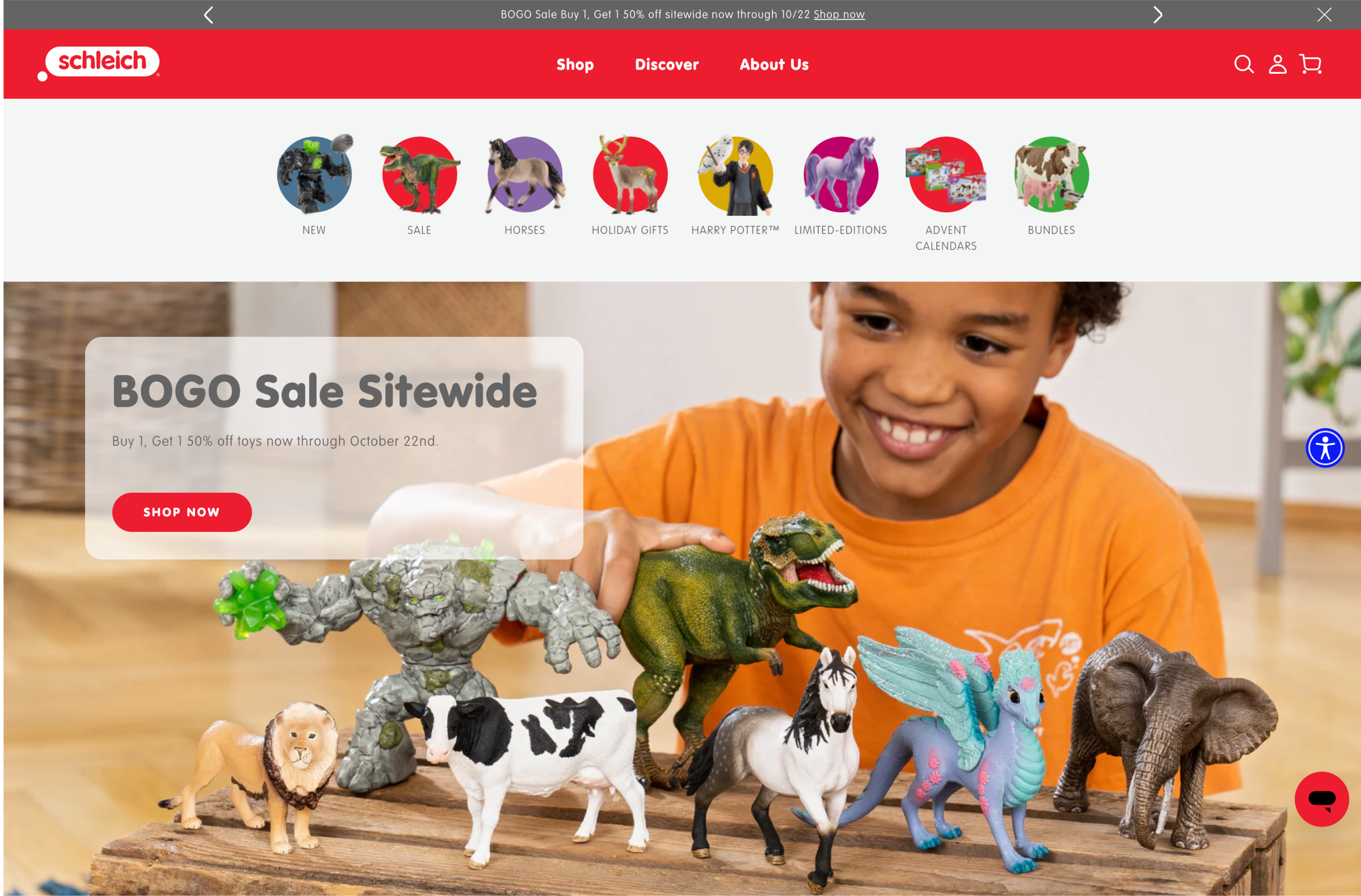Desktop screenshot of boy playing with various Schleich figurines