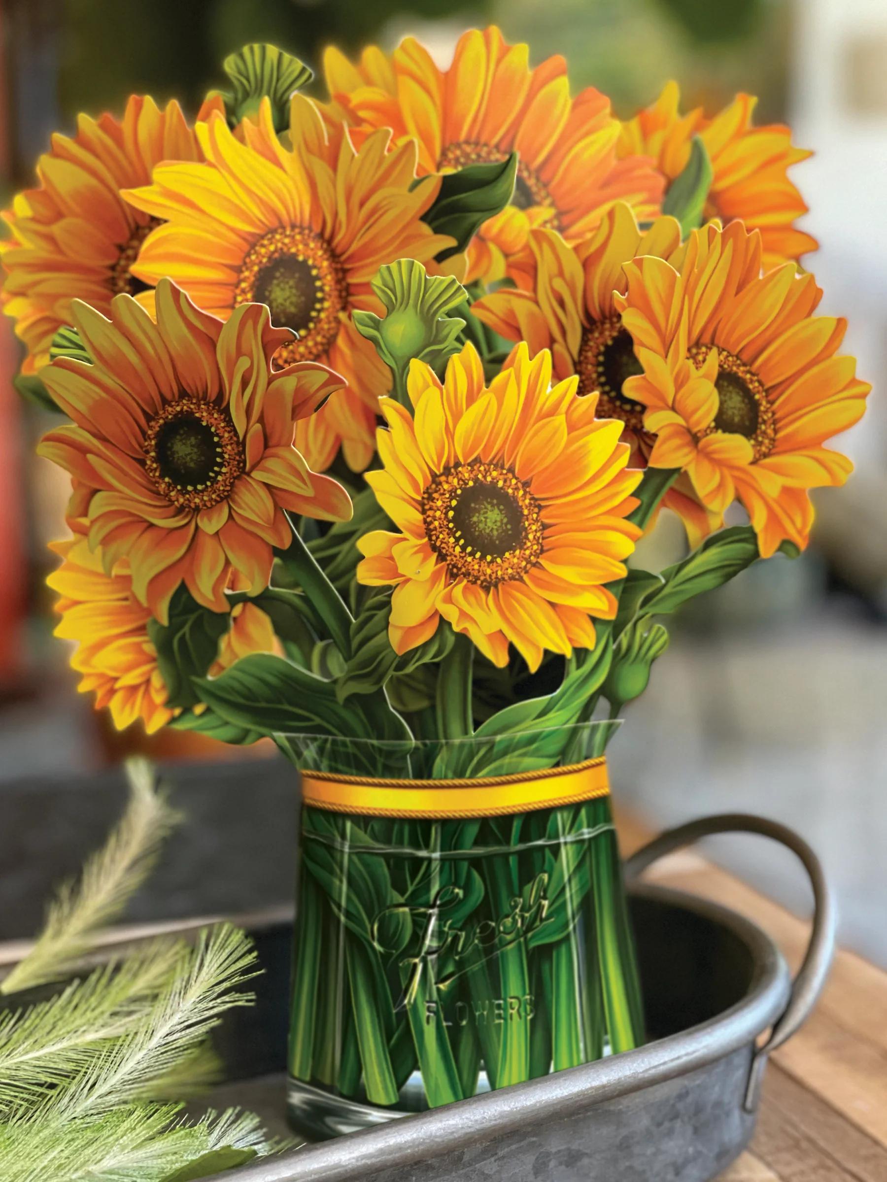 A vase full of Fresh Cut Paper sunflowers