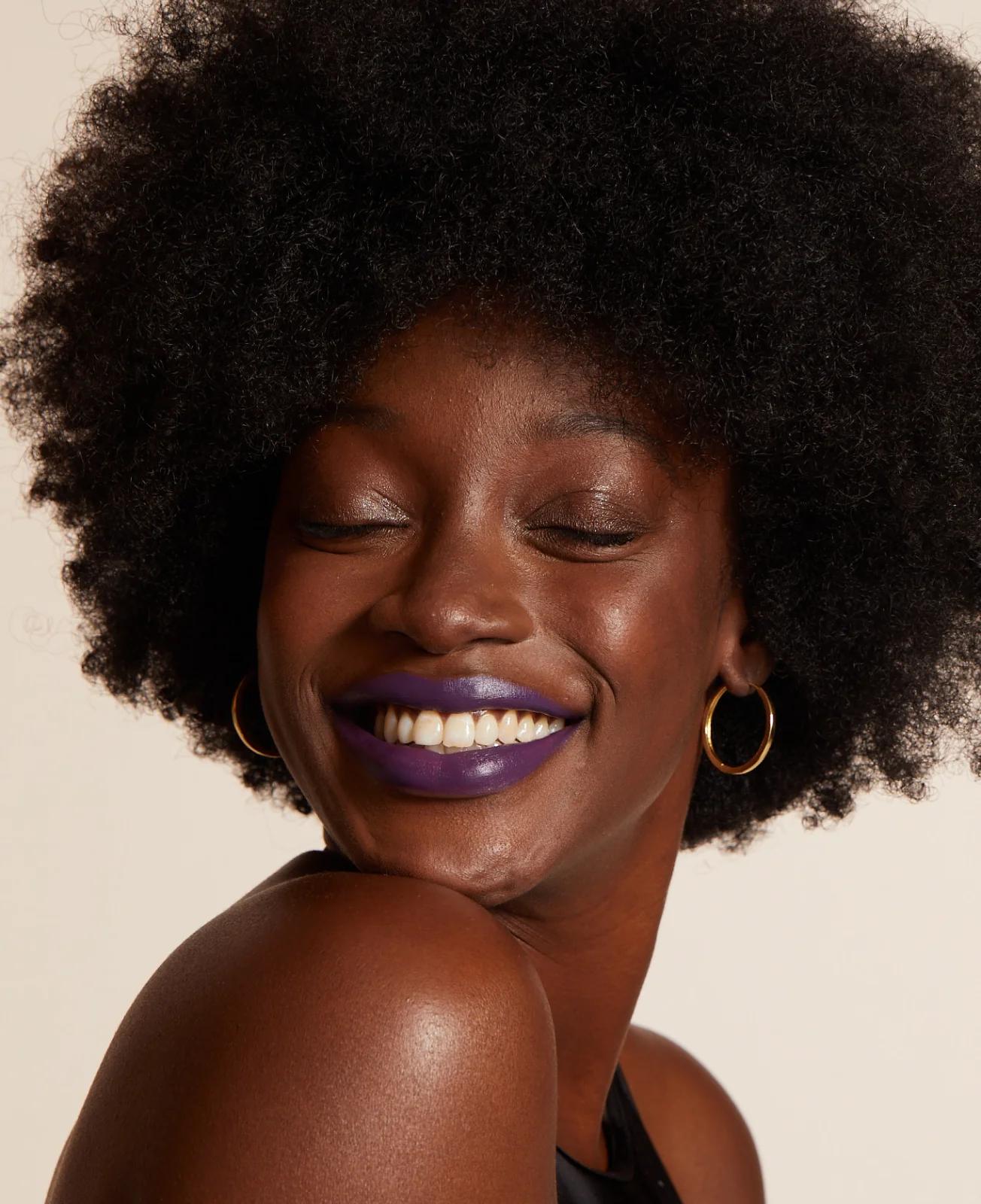 Smiling woman wearing Lip Lab lipstick