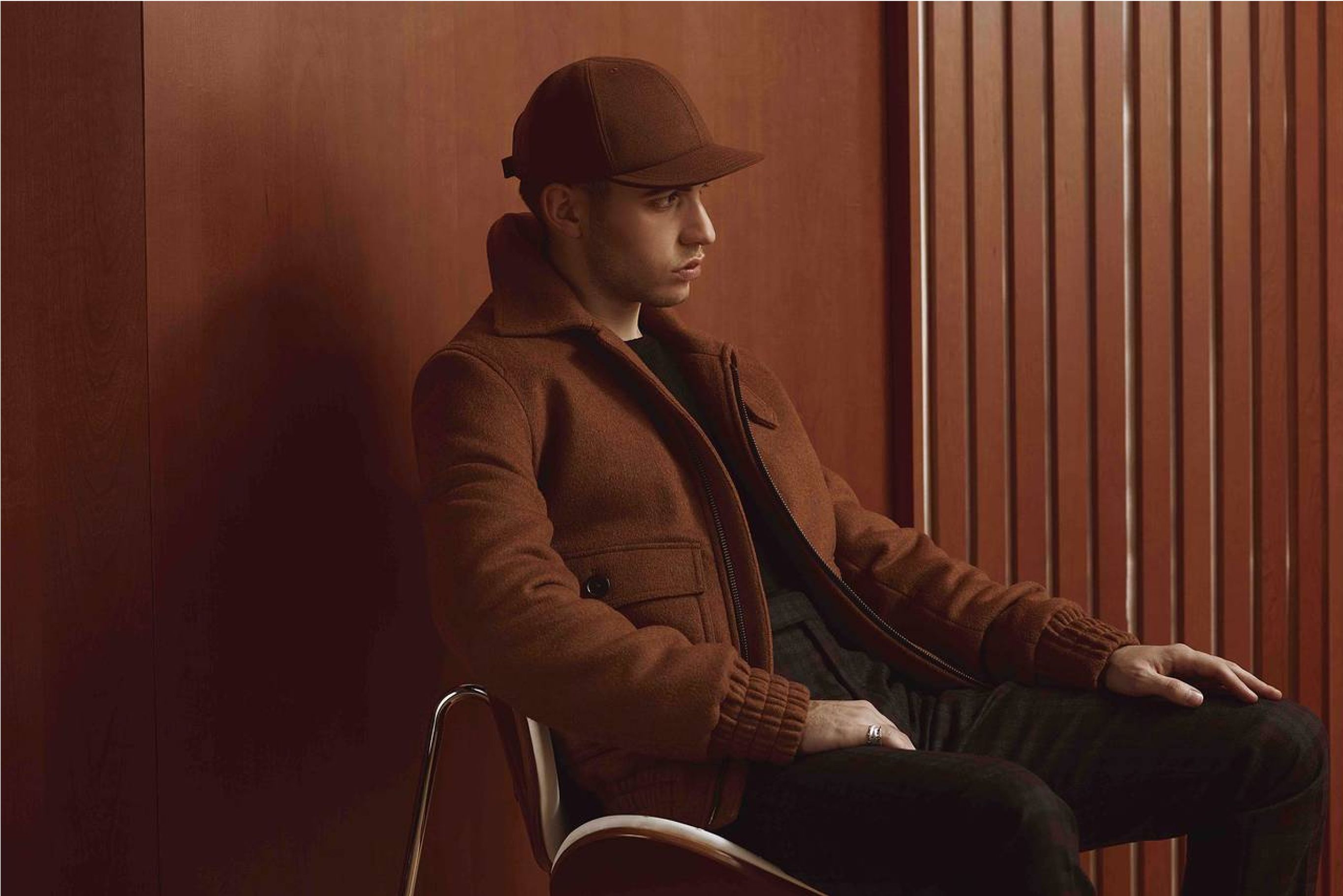 Man sitting in all brown Frank & Oak outfit