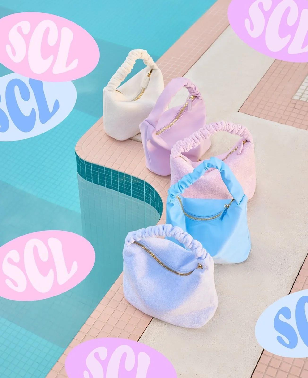 Various Stoney Clover Lane poolside bags with SCL badges