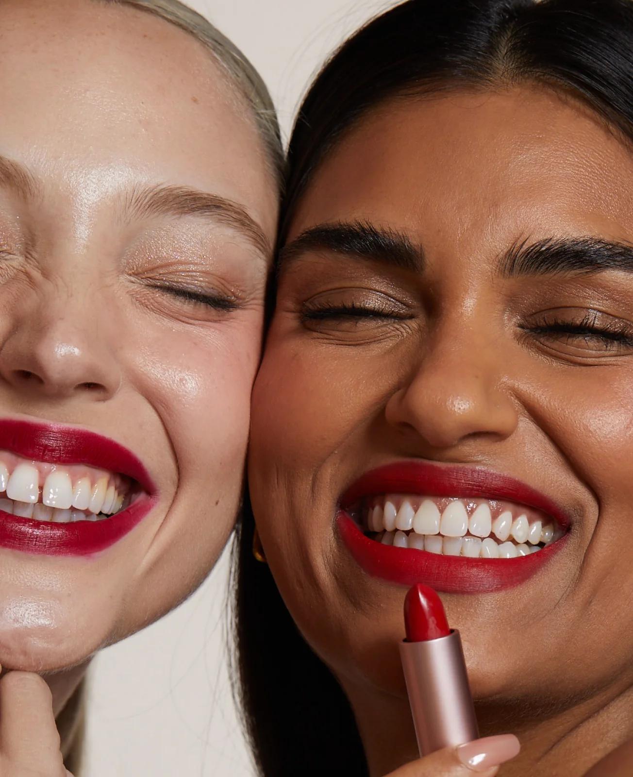 Smiling women wearing LipLab lipstiick