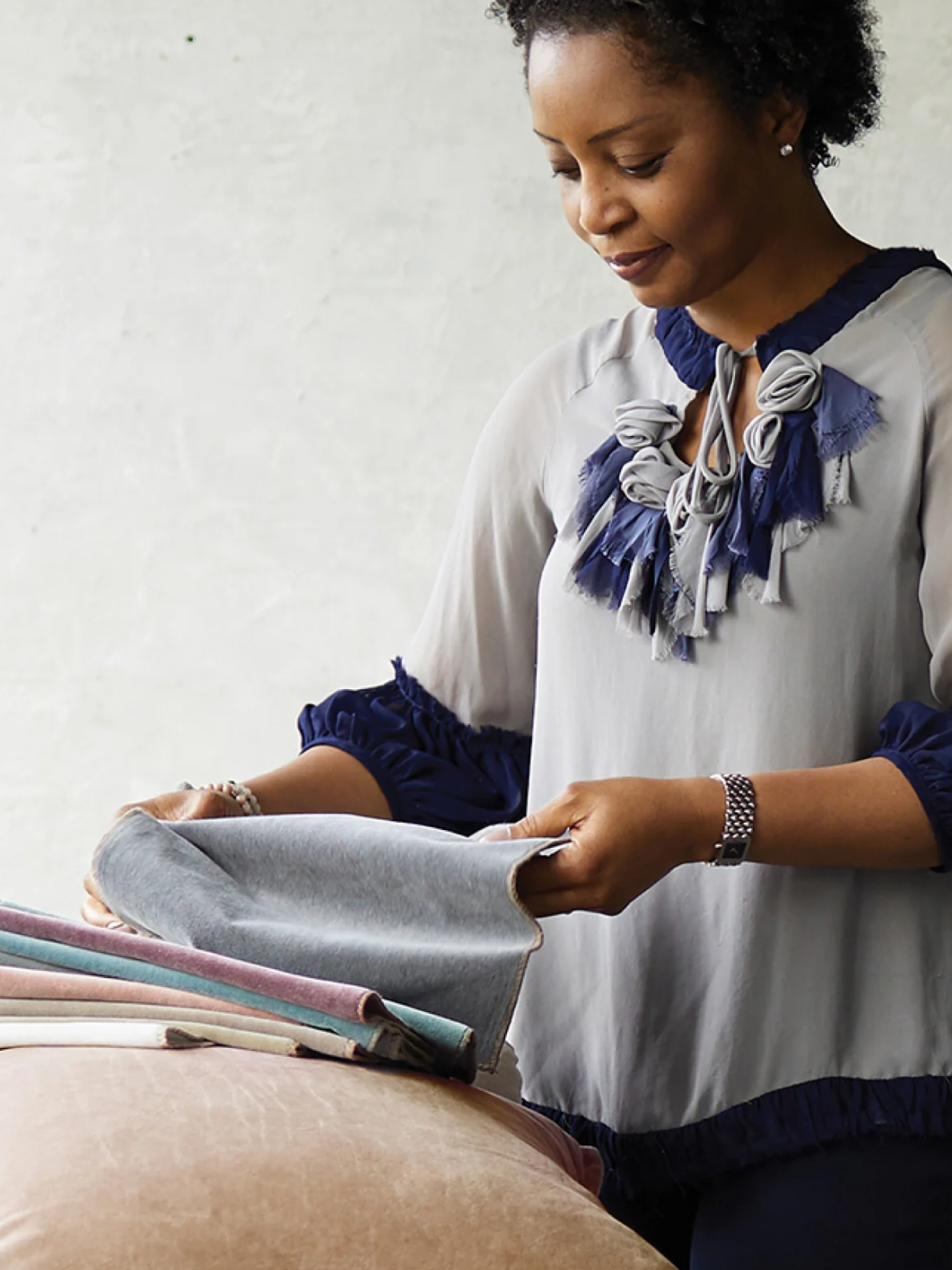 Image of women touching fabrics