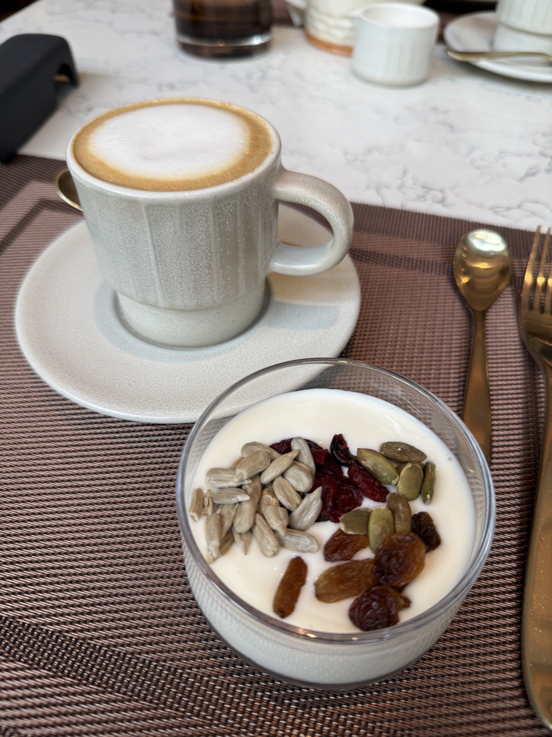 A charcuterie plate and coffee