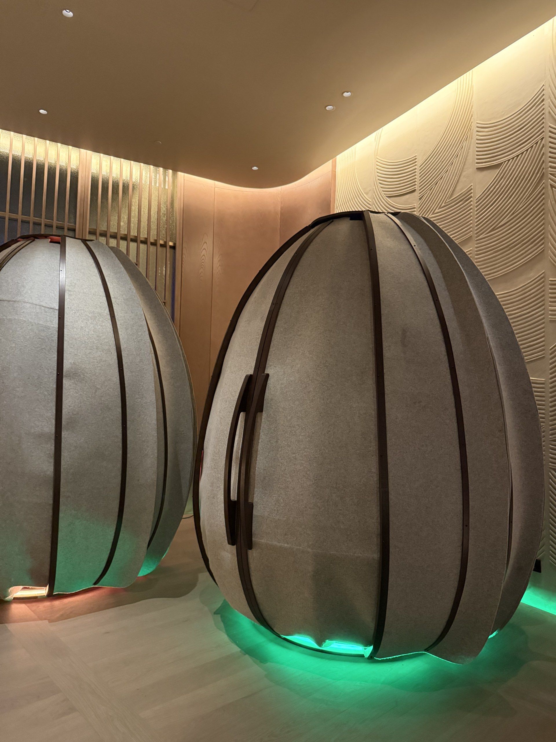 A softly lit meditation pod