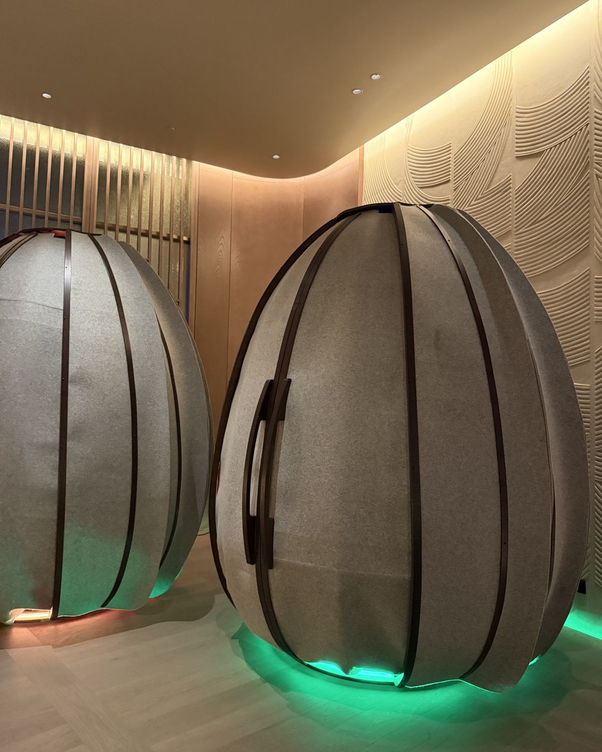 A softly lit meditation pod