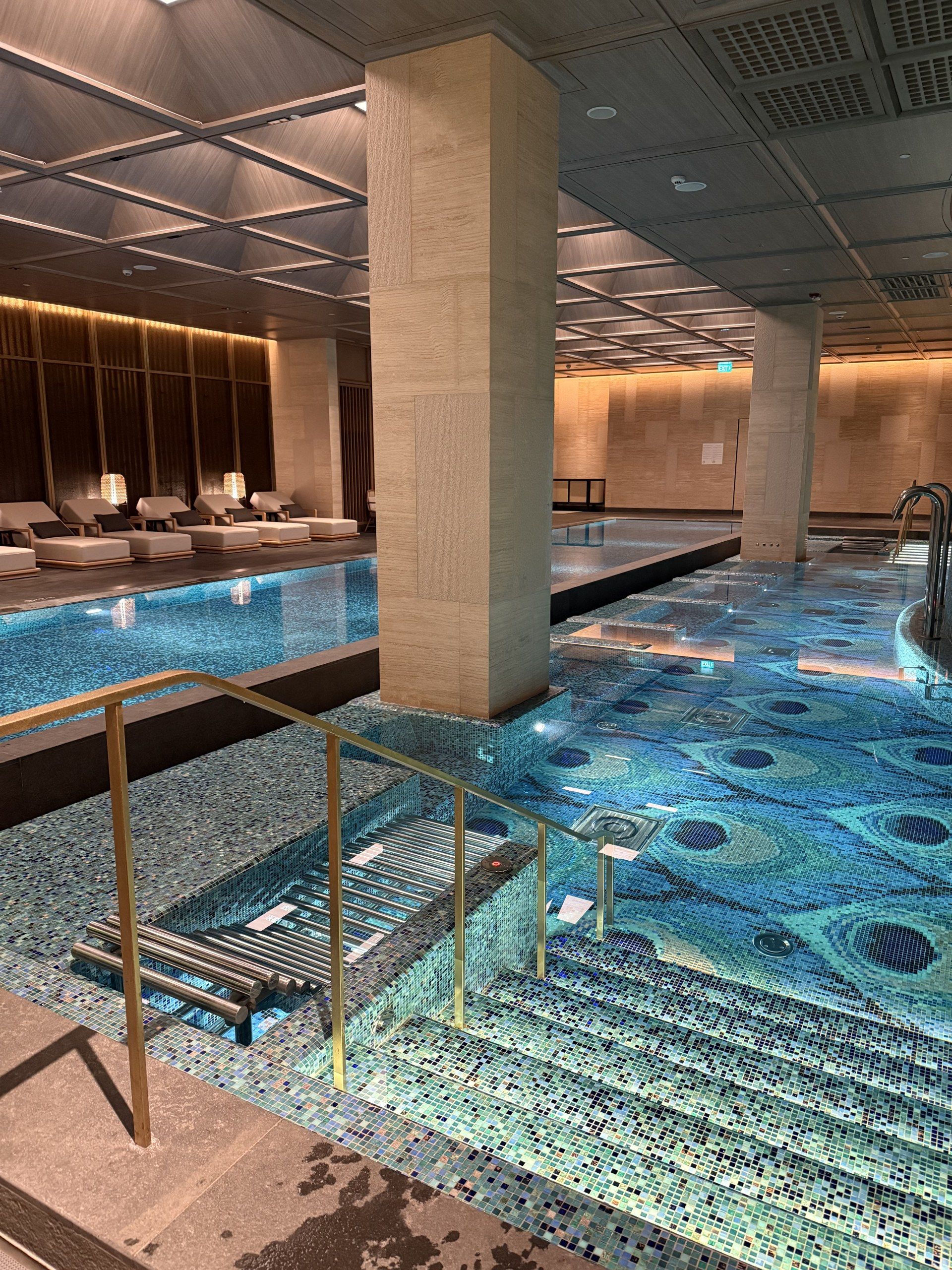 The indoor pool lined with blue mosaic