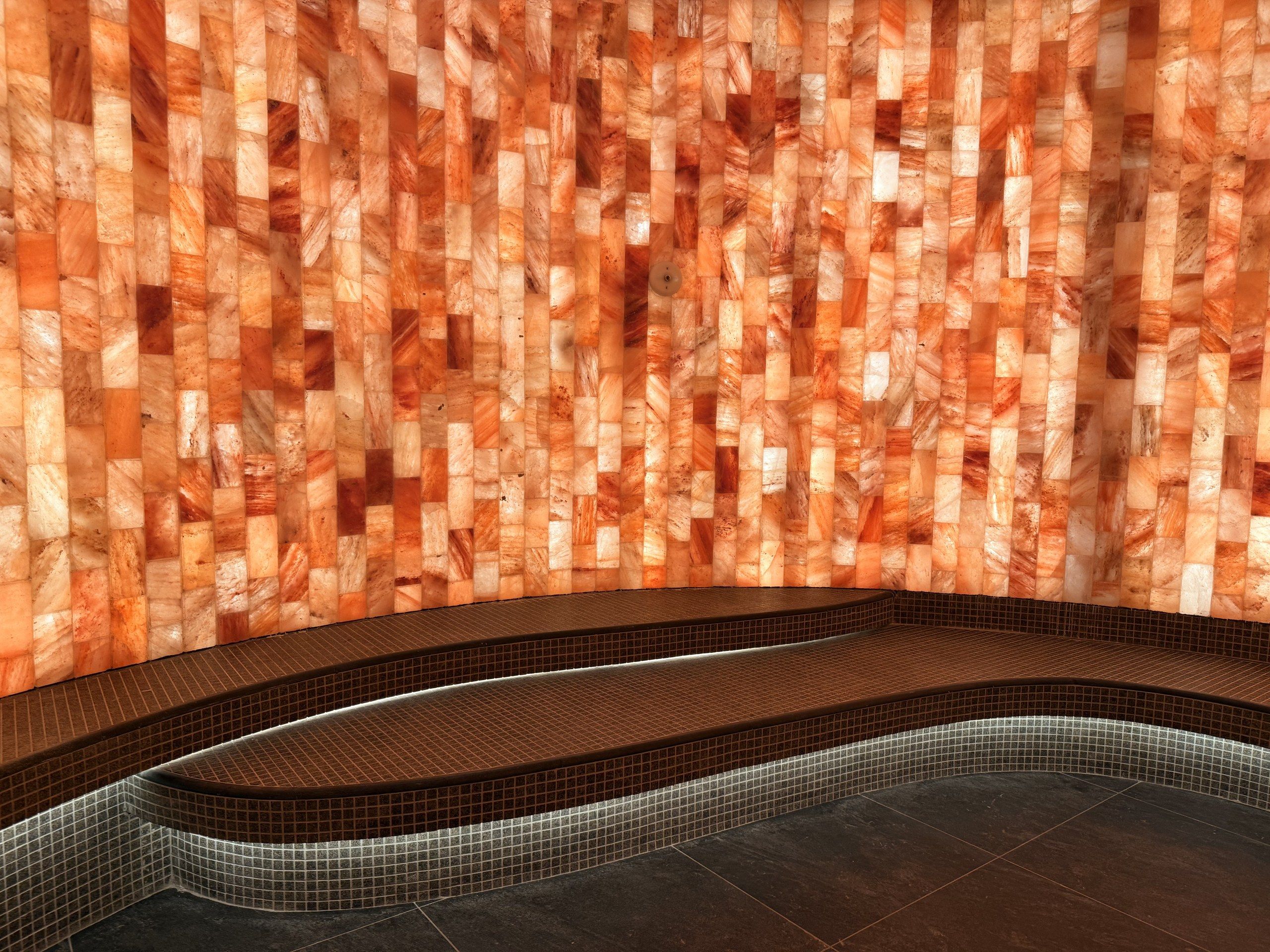 The glowing onyx wall by the jacuzzi