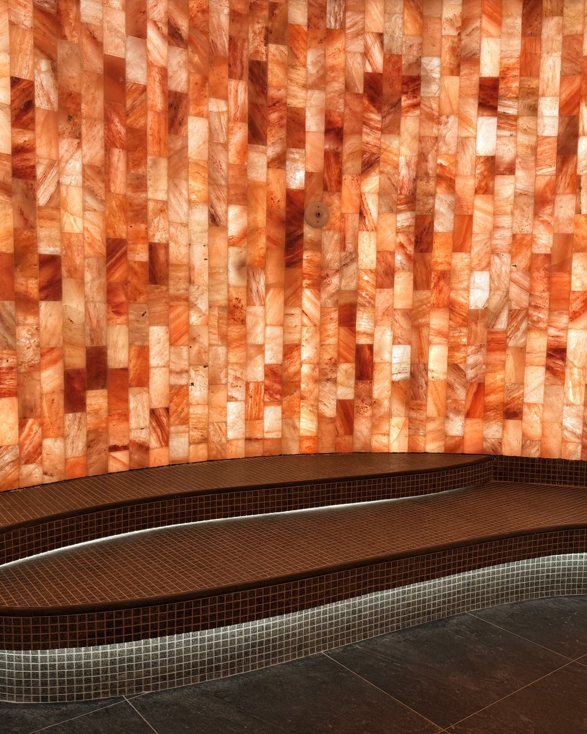 The glowing onyx wall by the jacuzzi