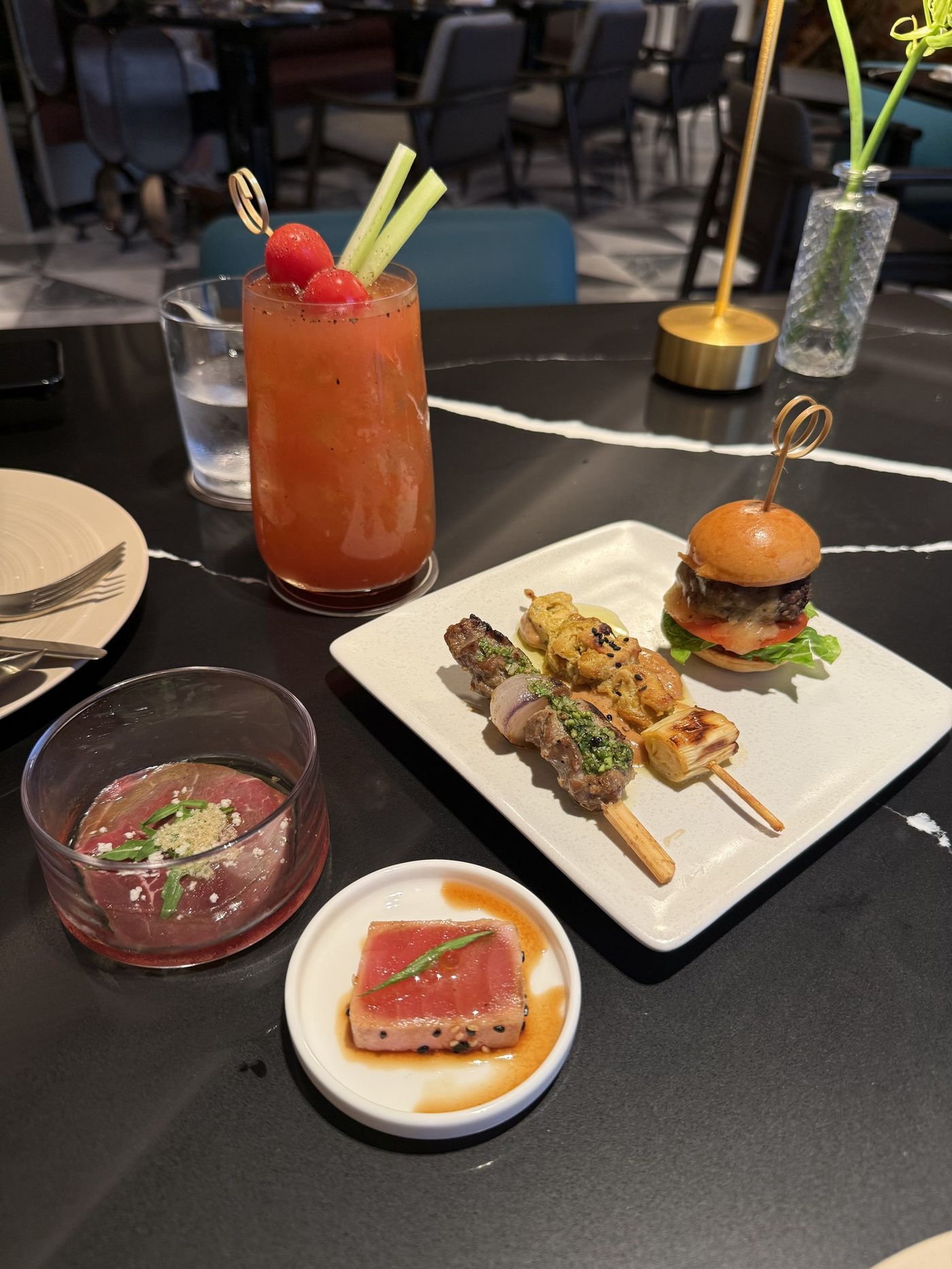 A Bloody Mary with evening canapés at the Gold Lounge