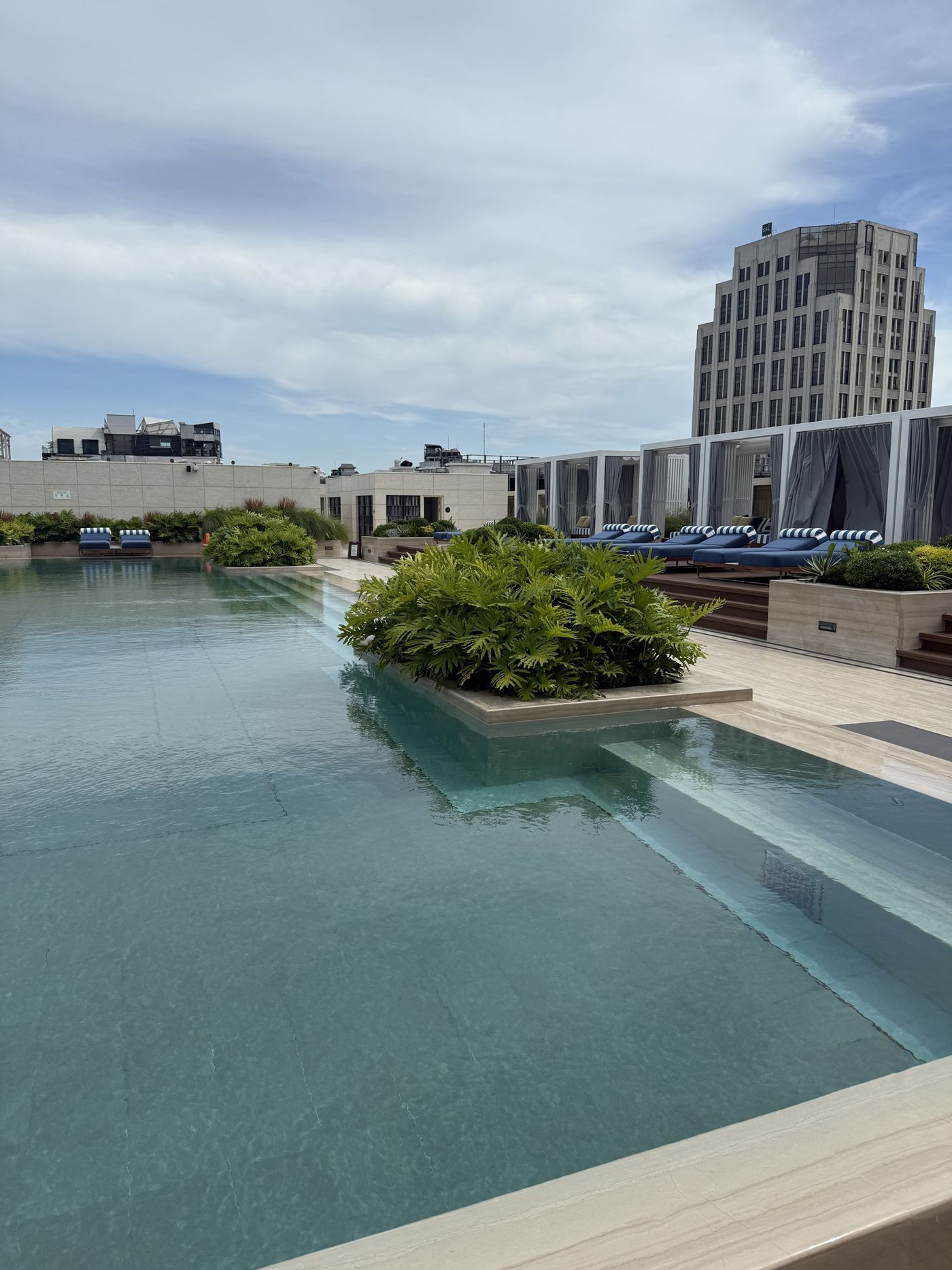 The rooftop infinity pool overlooking the Hanoi skyline