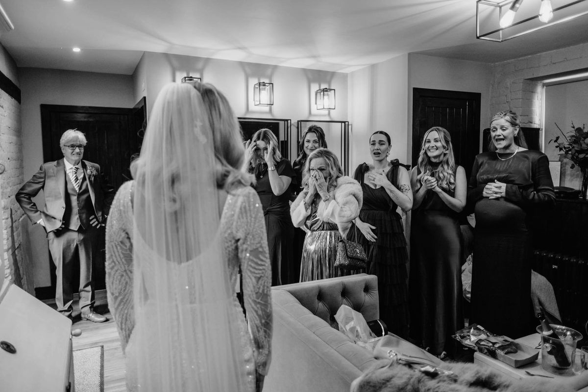 Bride reveal moment with family and friends reacting emotionally