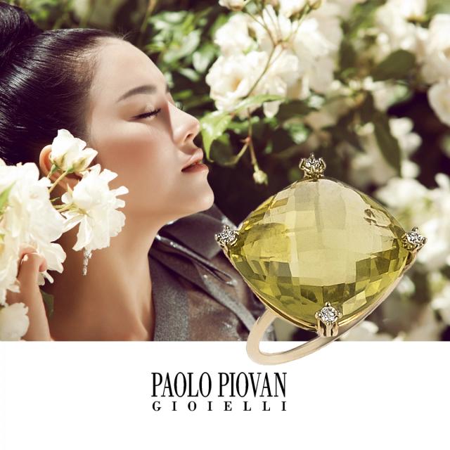 model with detail of ring with green stone