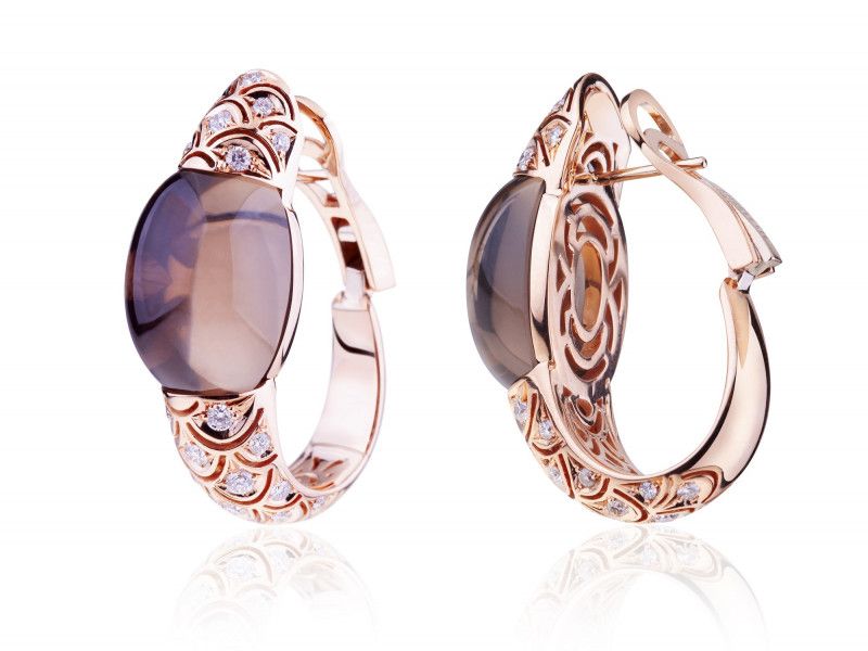gold earrings with precious stones